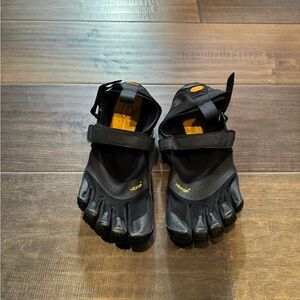 Pair of gently used, men’s, Black Vibram 5 finger shoes in size 11.5-12